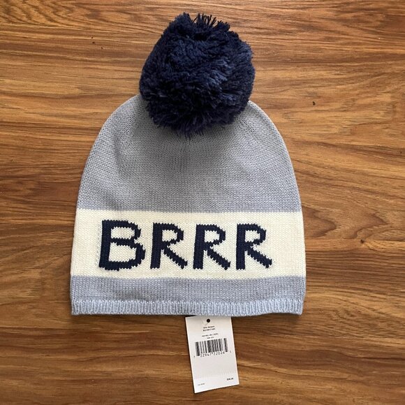 kate spade Accessories - NWT Kate Spade light blue and white winter hat with pom pom